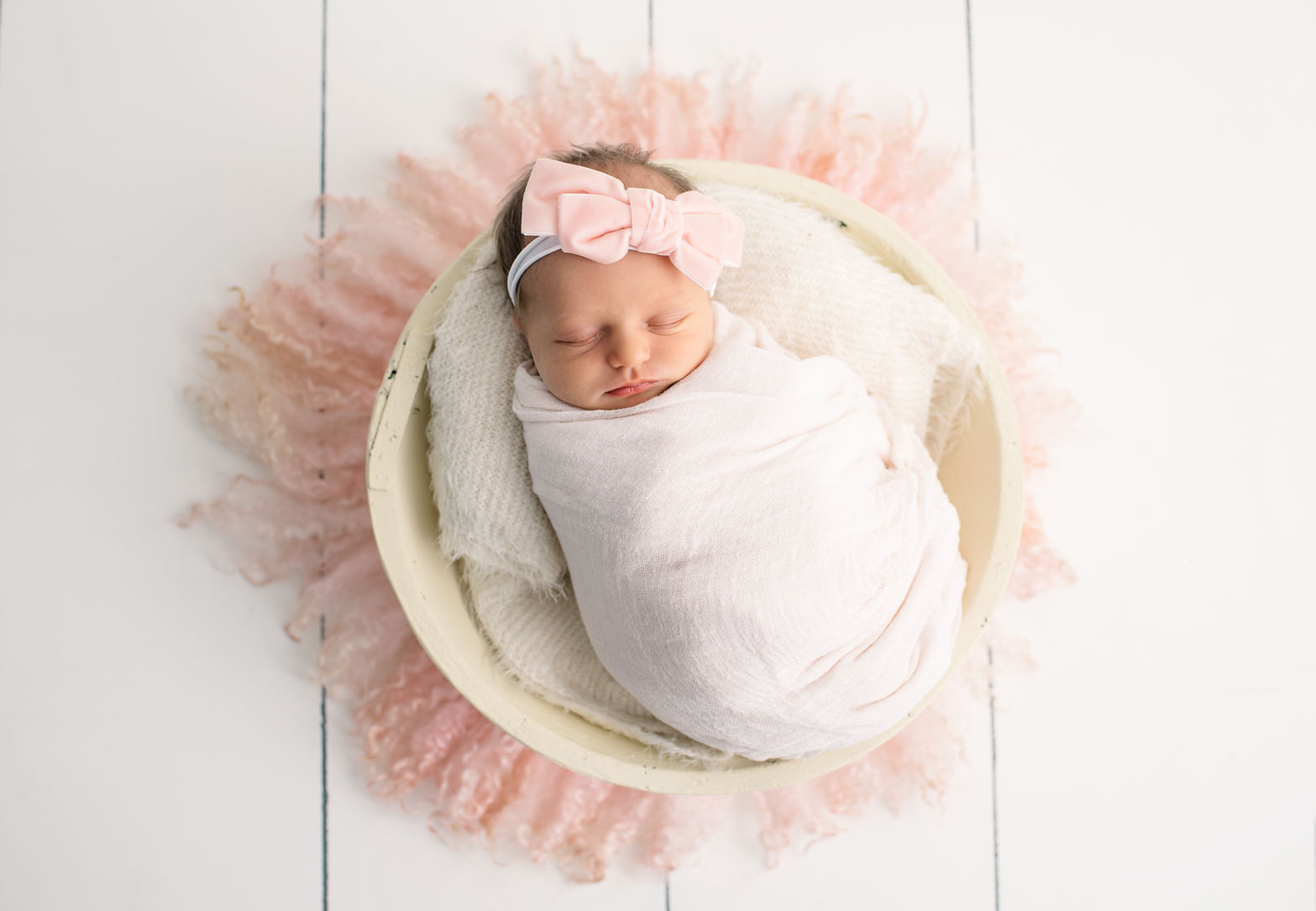 Newborn baby in pink