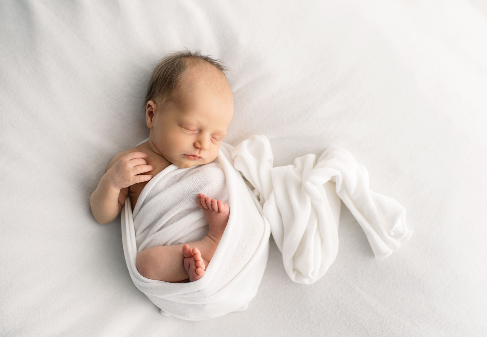 Newborn Baby In White