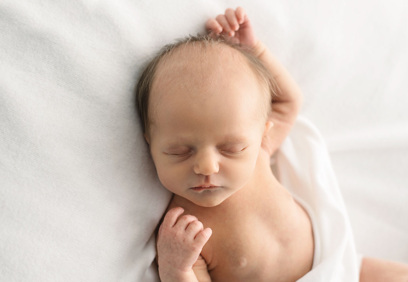 Newborn baby natural pose